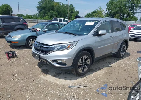 2016 Honda Cr-V Touring z USA, uszkodzony, nr VIN 5J6RM4H96GL065296